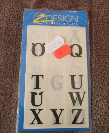 Samolepky černé písmena rozbaleno